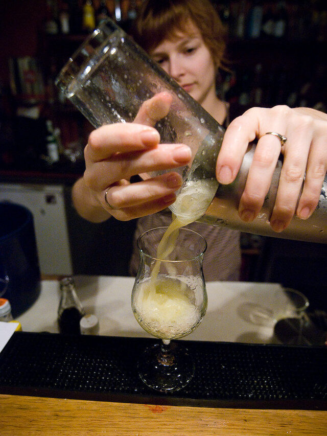 Bartender pouring a cocktail